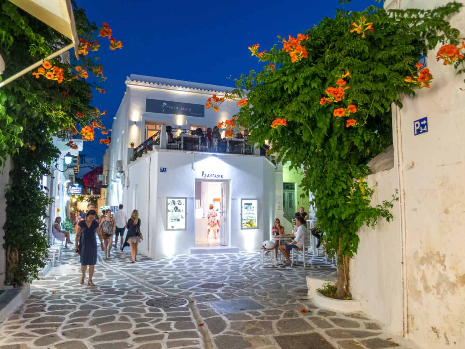 People walking around Parikia at night.
