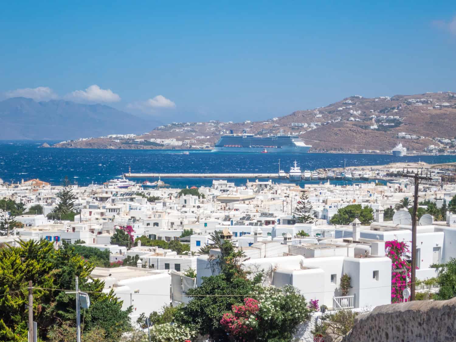 View of Old Town Mykonos and a cruise ship in the distance.