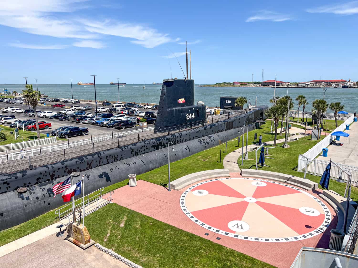 The water and parking lot for Seawolf Park as seen from Galveston Naval Museum.