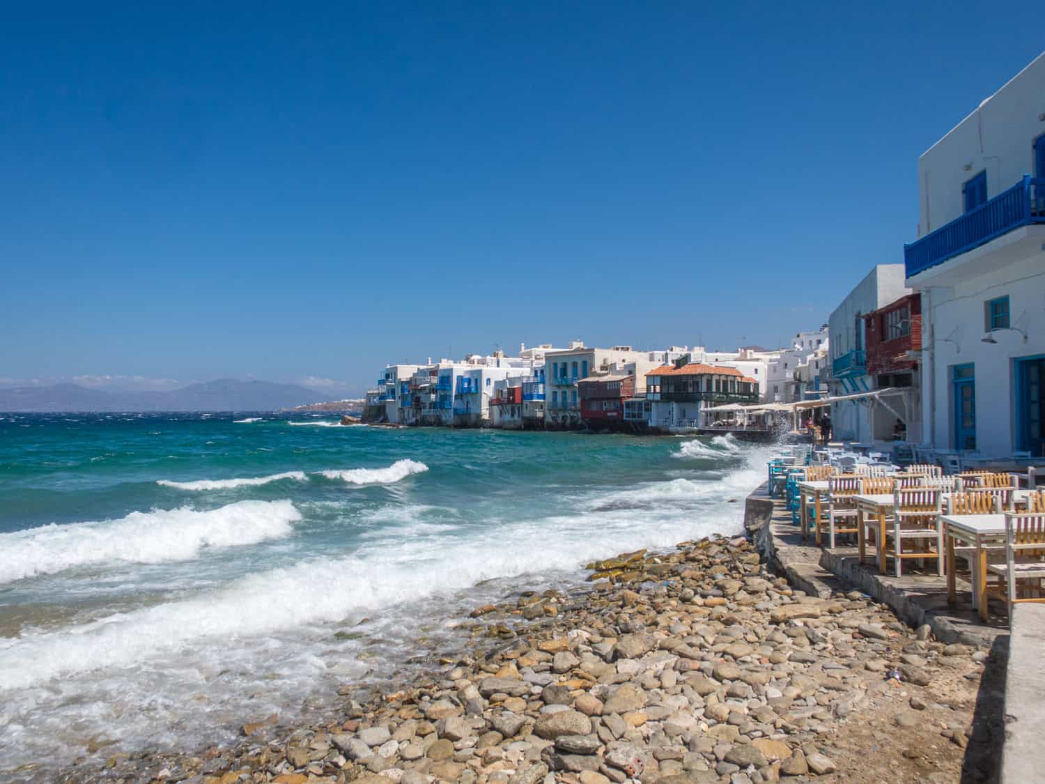Waves lap up against Little Venice in Old Town Mykonos.
