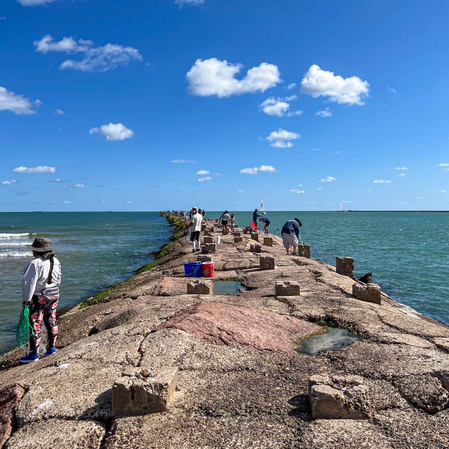 People fishing off the South Padre Island Jetties.