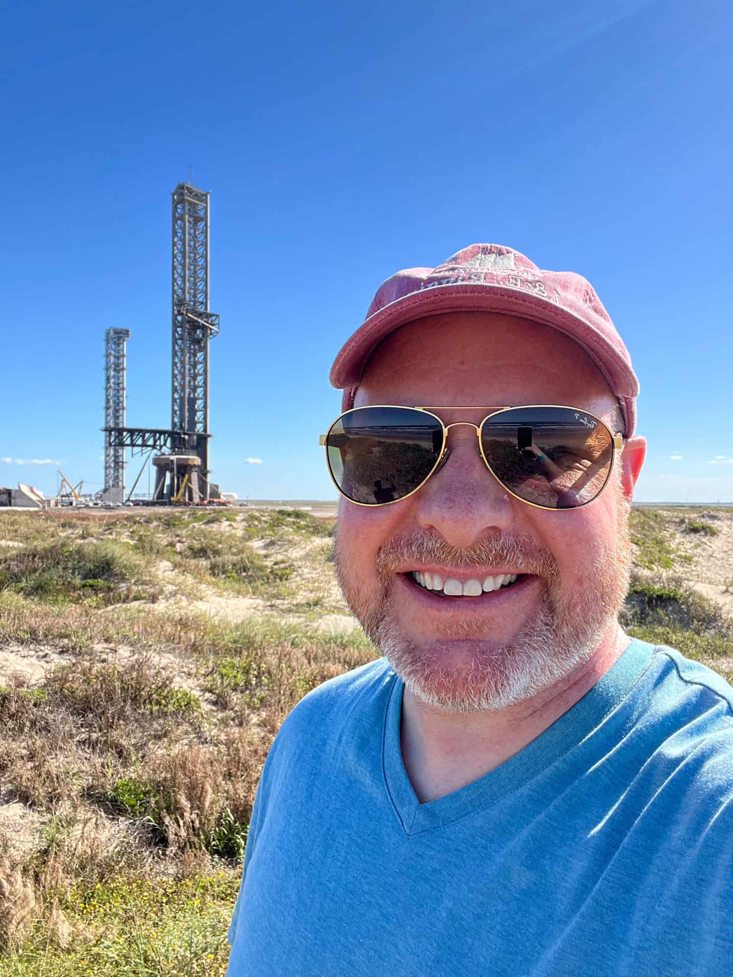 Dave takes a selfie on Boca Chica Beach with the SpaceX Starship Orbital Launch Pad in the background.