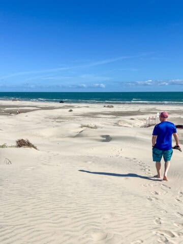 Dave walking down a dune on South Padre Island (photo by Kelly Lemons).