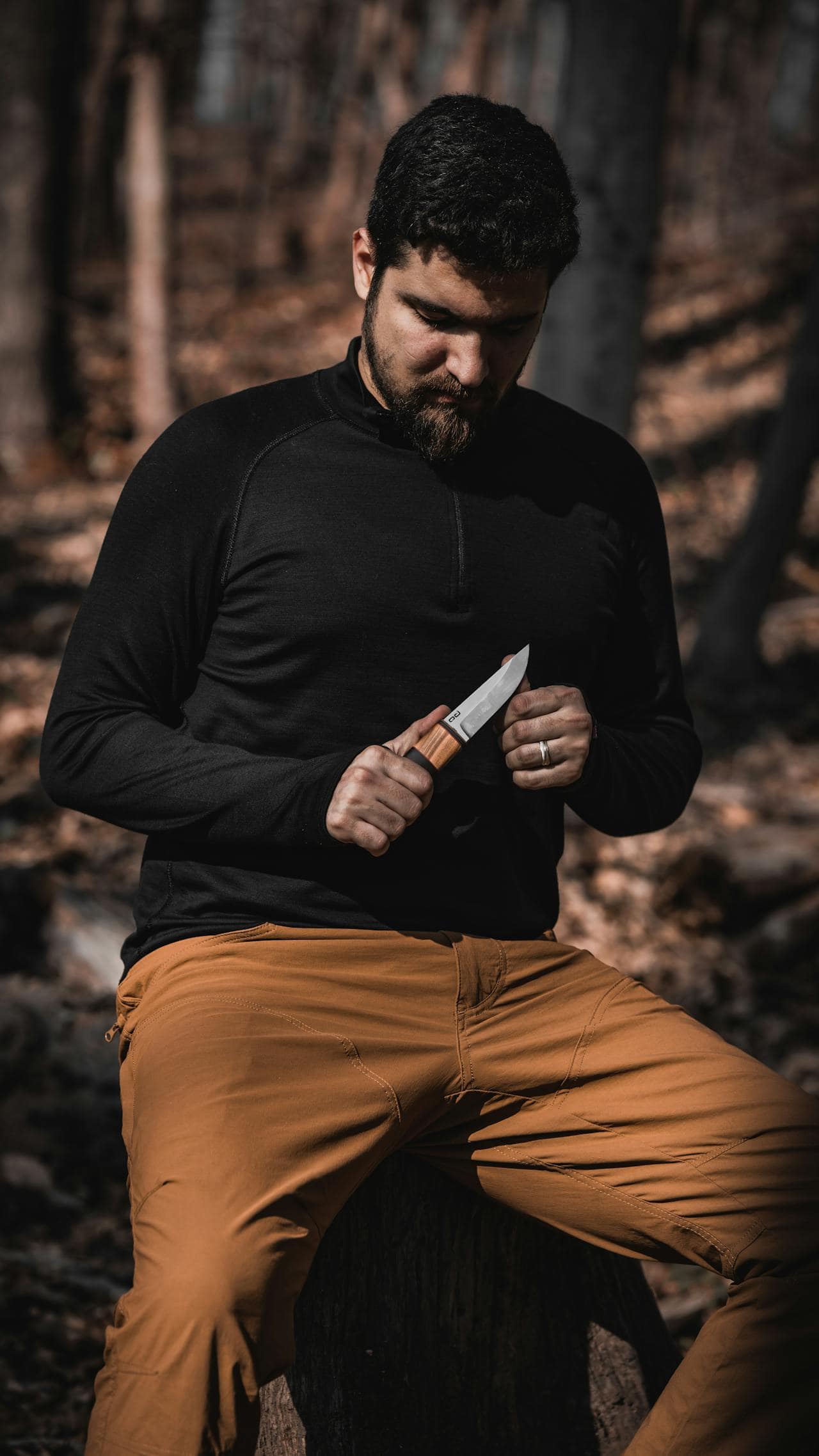 Man in woods with a blade (photo by Araz Yurtseven).