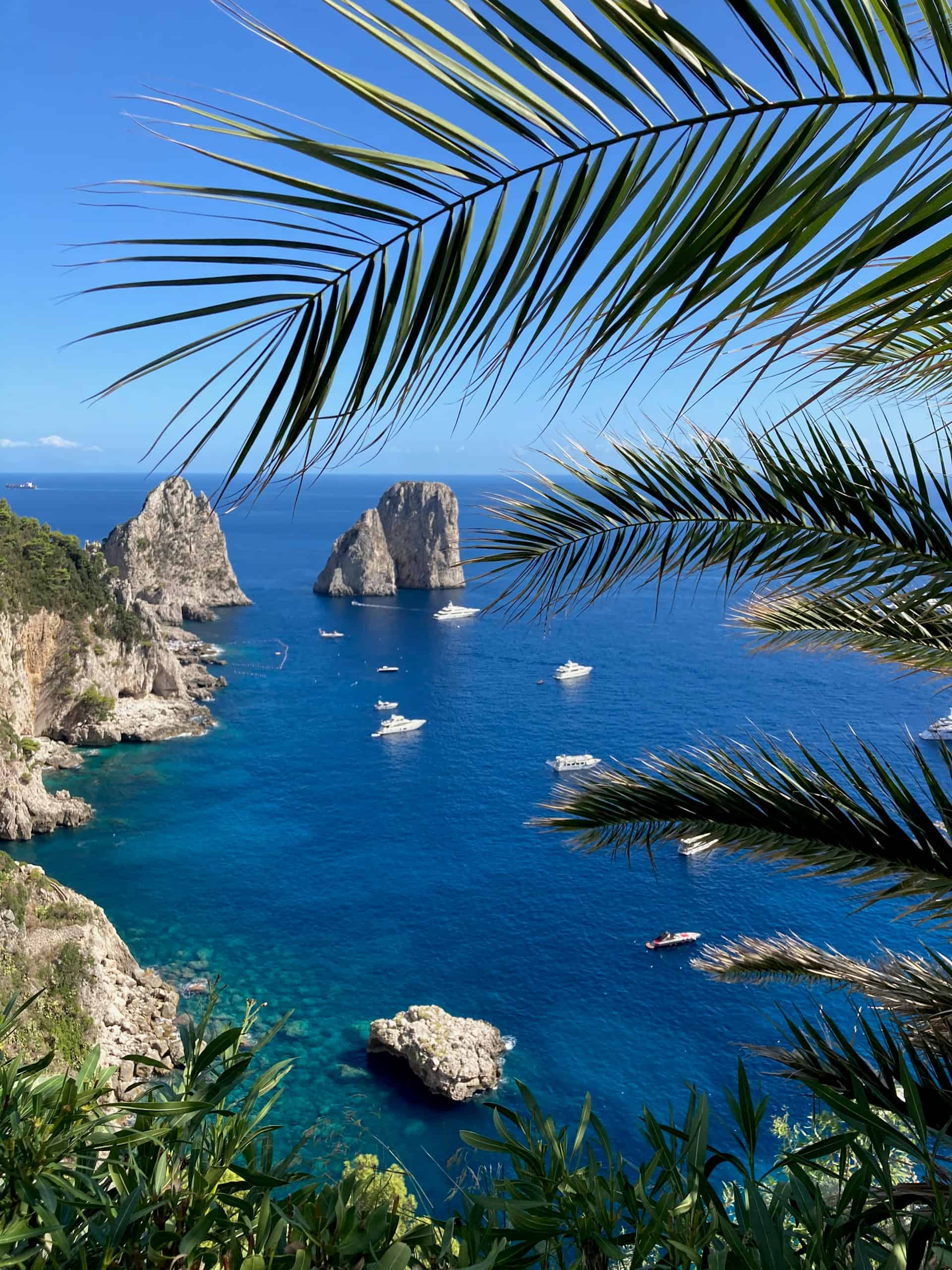 The Faraglioni rocks are visible from Le Monzù restaurant on Capri (photo by Sofia, Unsplash).