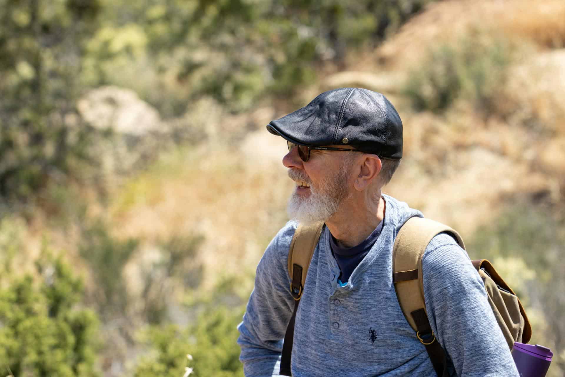 An older man backpacking (photo: David Brown, Pexels).