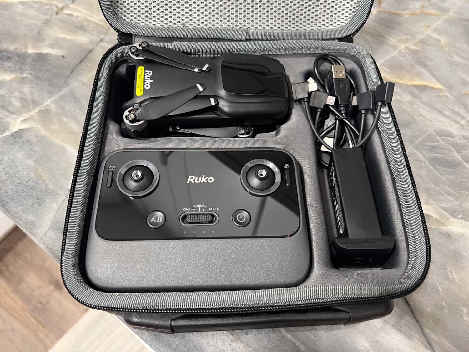 The Ruko U11MINI 4K drone in its carrying case (included).