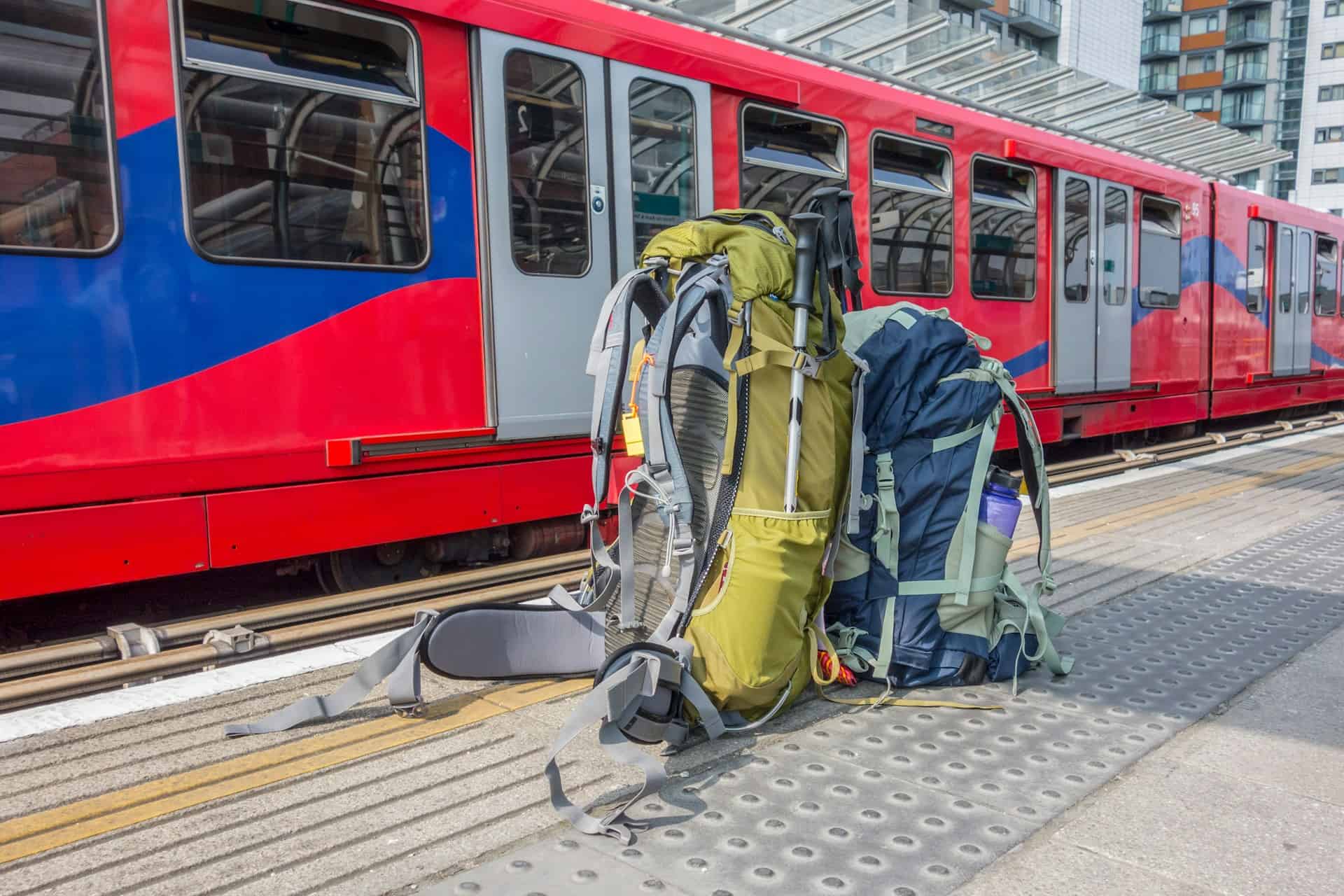 A pair of backpacks rest on a train platform (photo: Ian Taylor).
