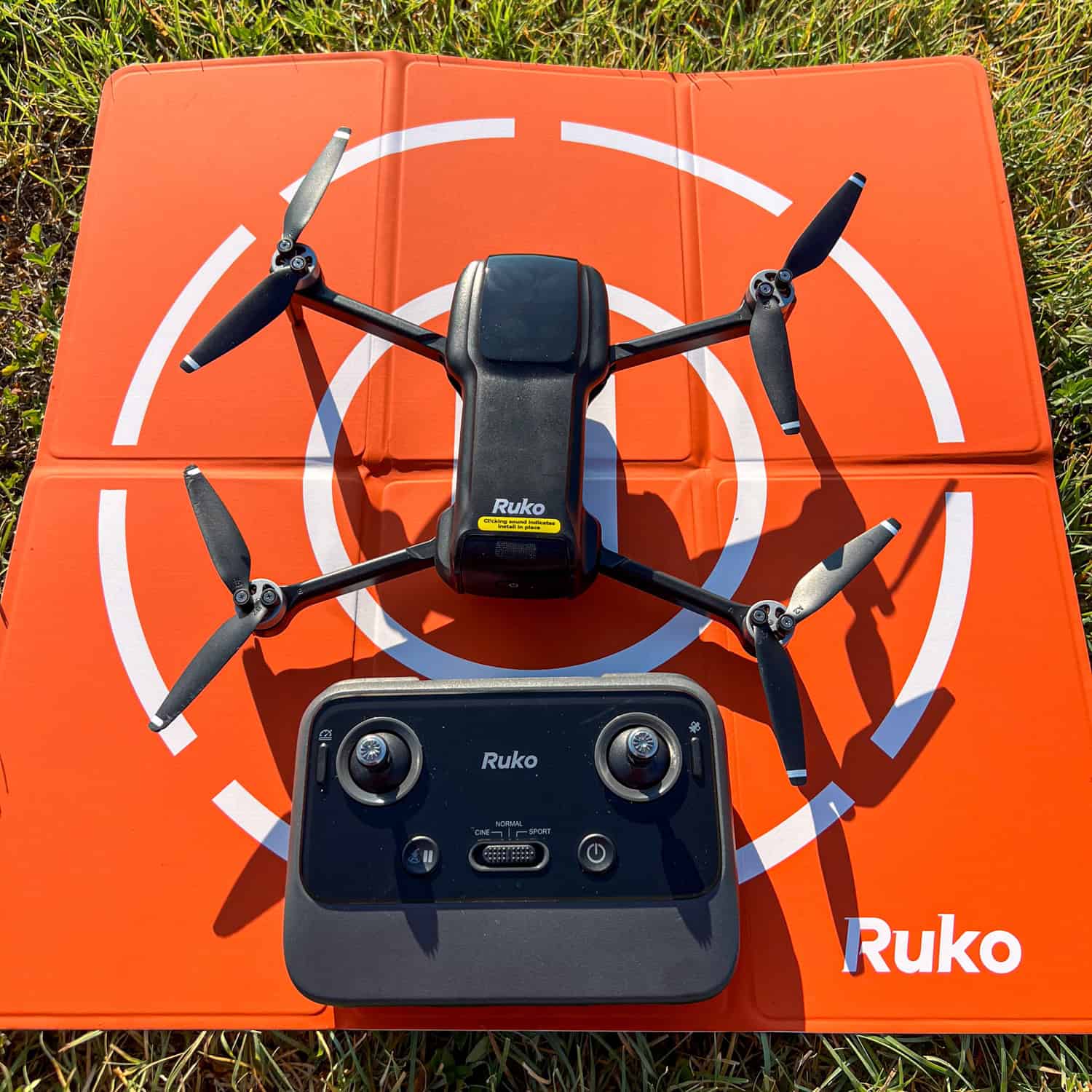 The Ruko U11MINI 4K drone, remote, and launch pad.