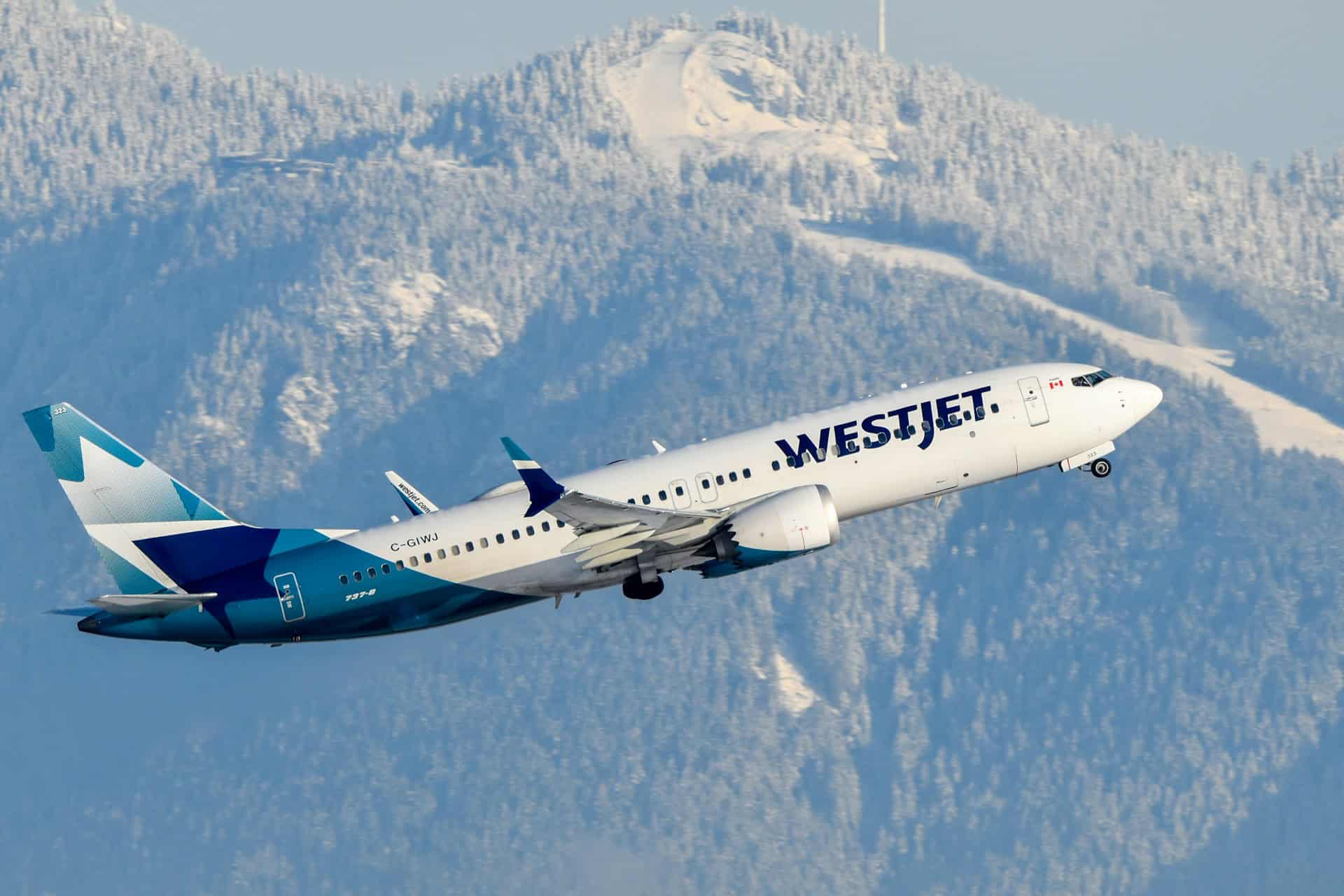 Save on travel from Canada to European cities with a budget-friendly carrier like WestJet, seen here taking off from Vancouver (photo: David Syphers).