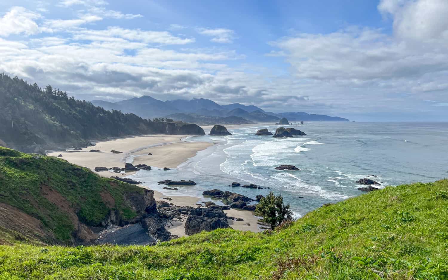 View of Cannon Beach and sea stacks from Ecola State Park on the Oregon Coast. View of Cannon Beach and sea stacks from Ecola State Park on the Oregon Coast.