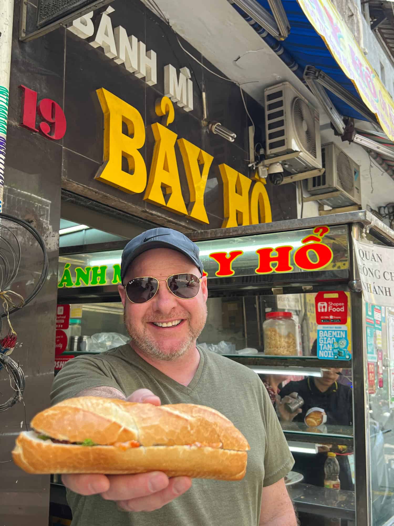 Grabbing a banh mi in Saigon (photo by Kelly Lemons).