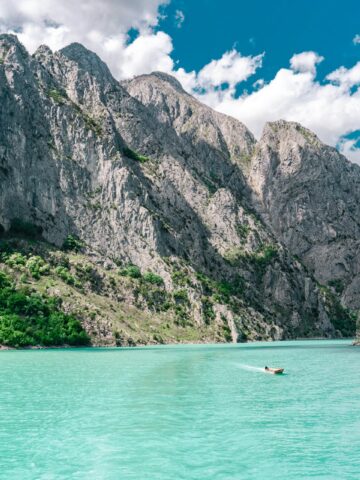 Komani Lake in Albania (photo: Johnny Africa, Unsplash).