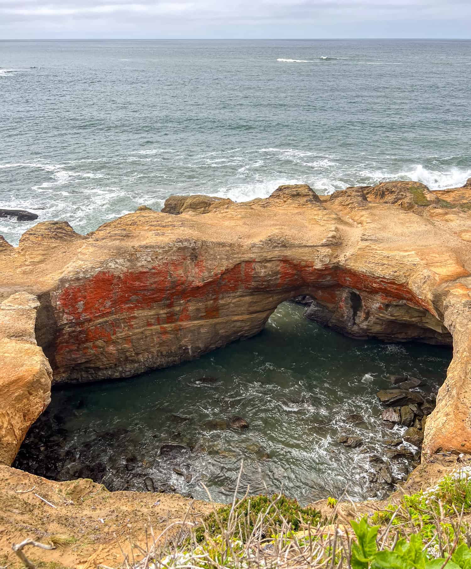View of Devils Punchbowl from above at high tide.