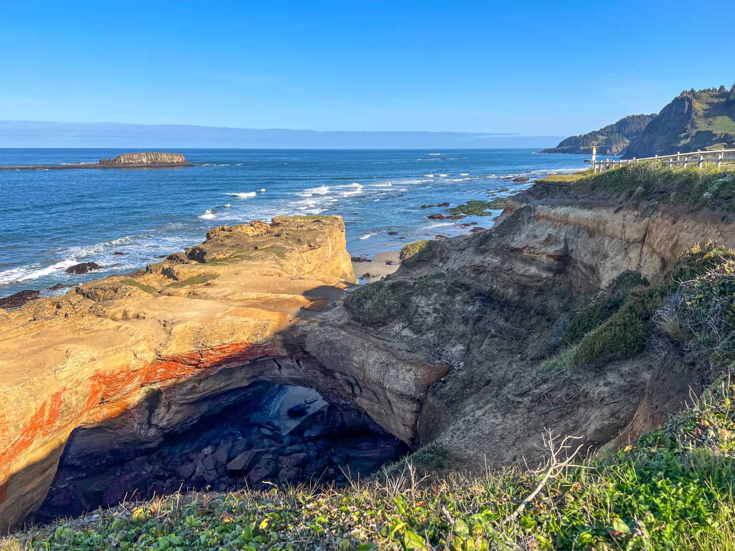 View of Devils Punchbowl at low tide and the Pacific Ocean.