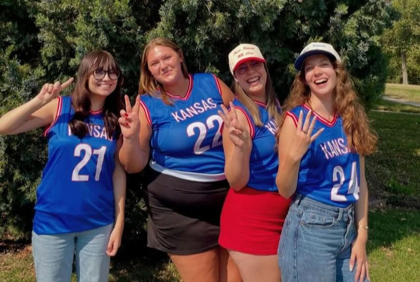 Group of friends in Kansas jerseys outdoors (photo: Sports Gear Swag Gallery).