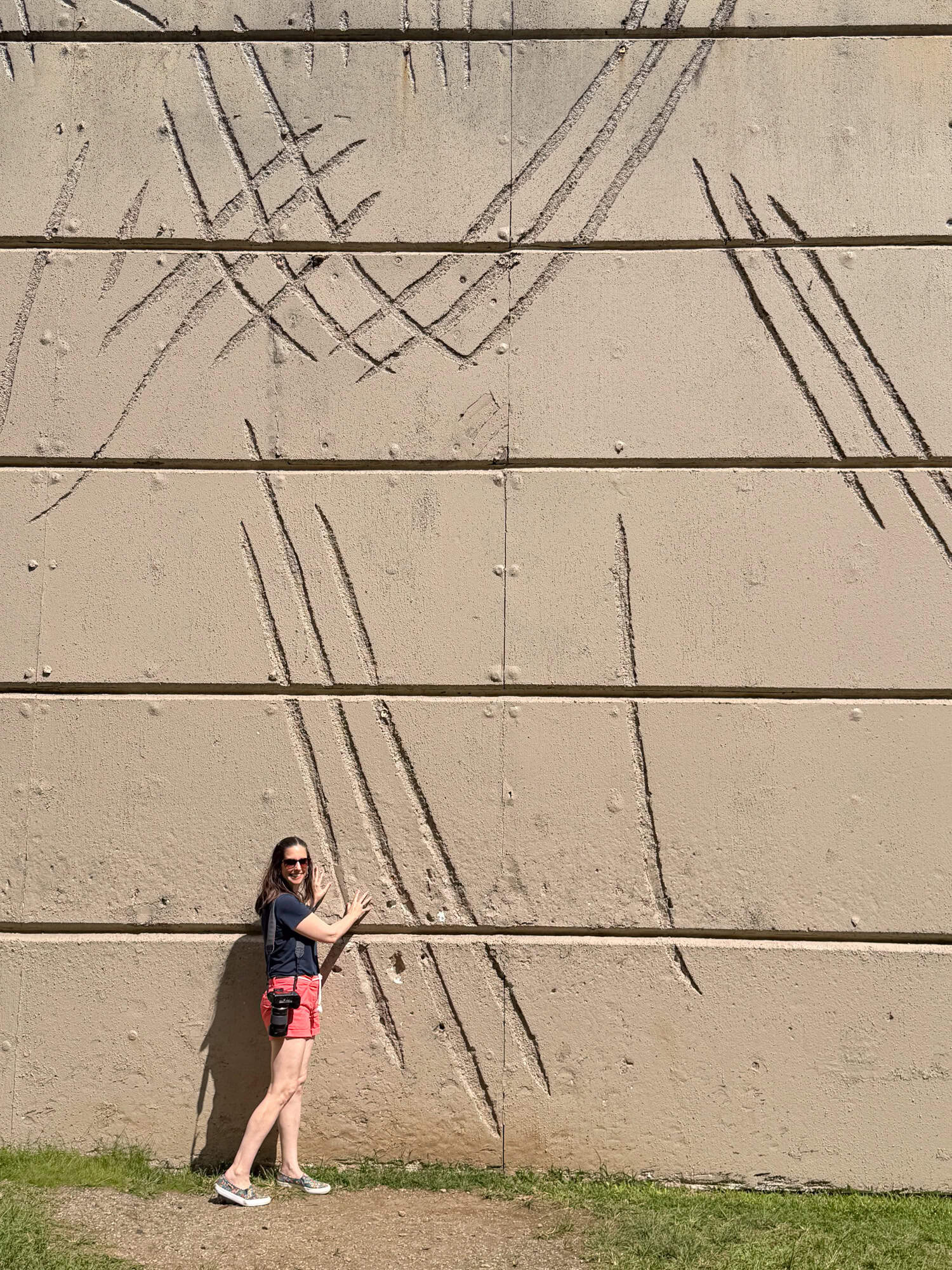 Kel stands by the Indominus Rex claw marks on the Jurassic Adventure Tour on Kualoa Ranch.