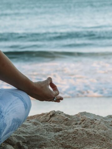 Meditating on the Gold Coast of Australia (photo: Chelsea Gates, Unsplash).