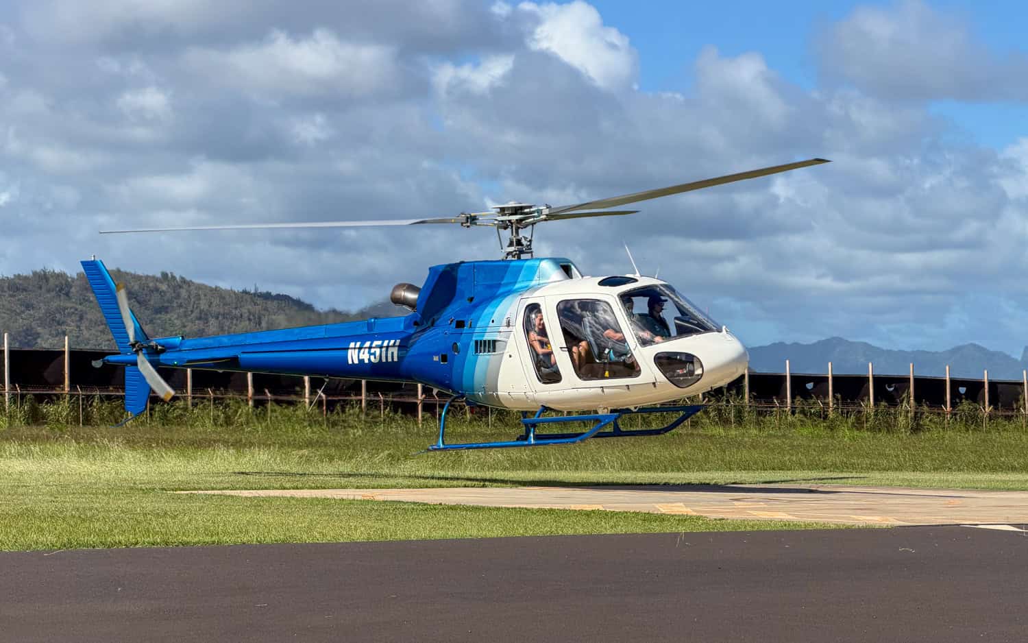 An Airbus AStar helicopter used by Island Helicopters Kauai prepares to land at Lihue Airport.