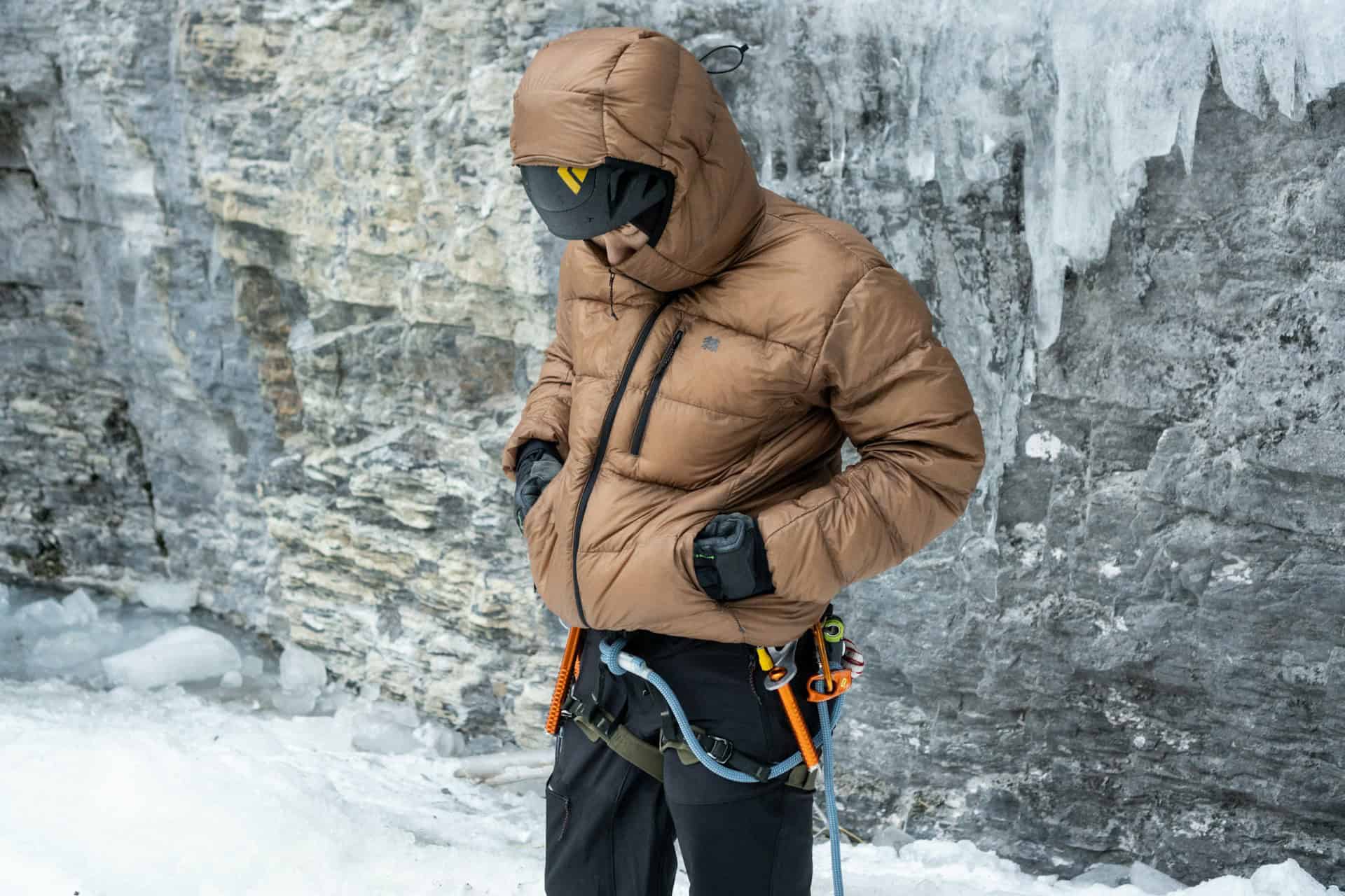 A climber in a down jacket (photo: Chewool Kim, Unsplash).