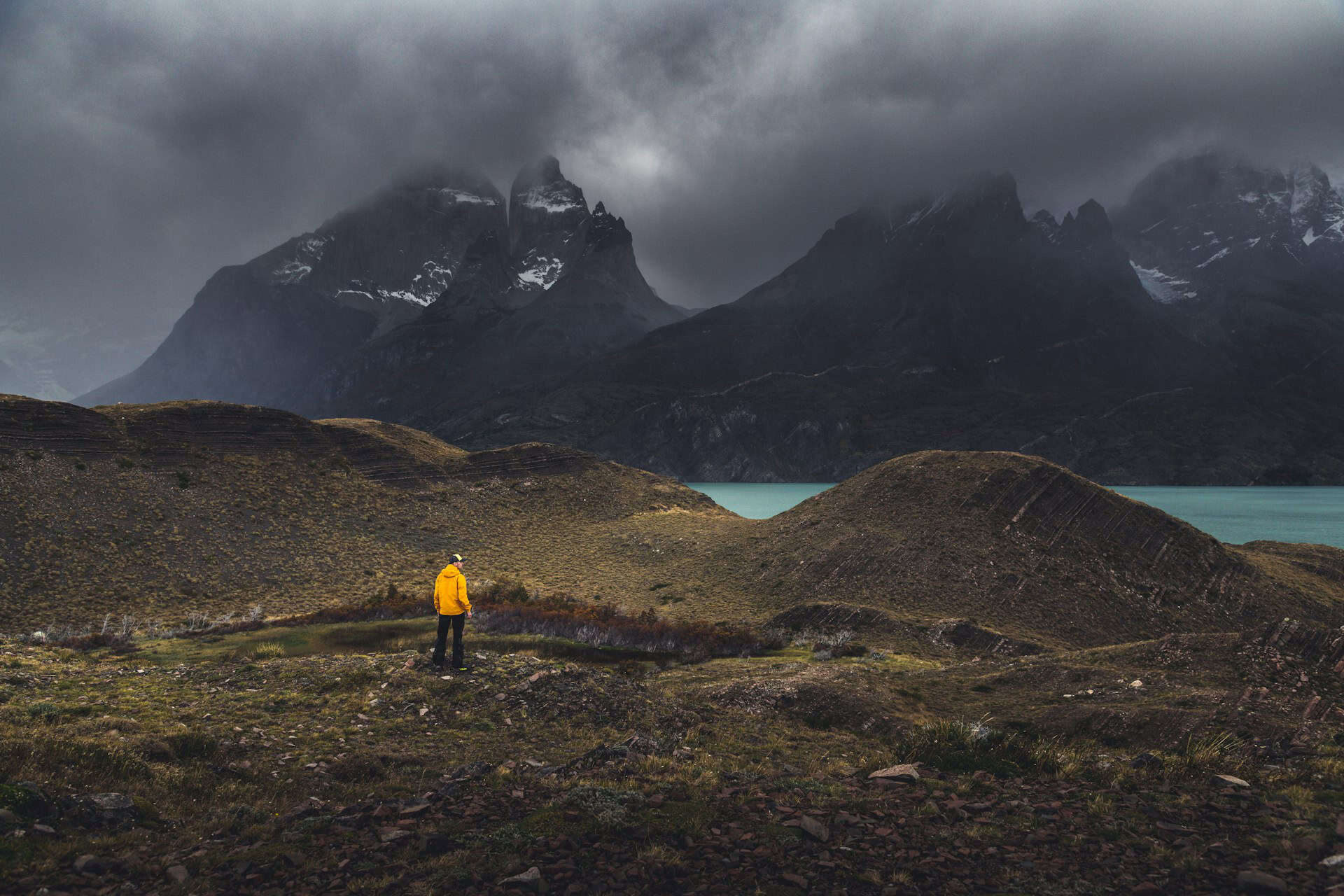 A hiker wearing a lightweight waterproof shell, one of the best jackets for backpacking - Torres del Paine National Park, Argentina (photo: Andrew Svk).
