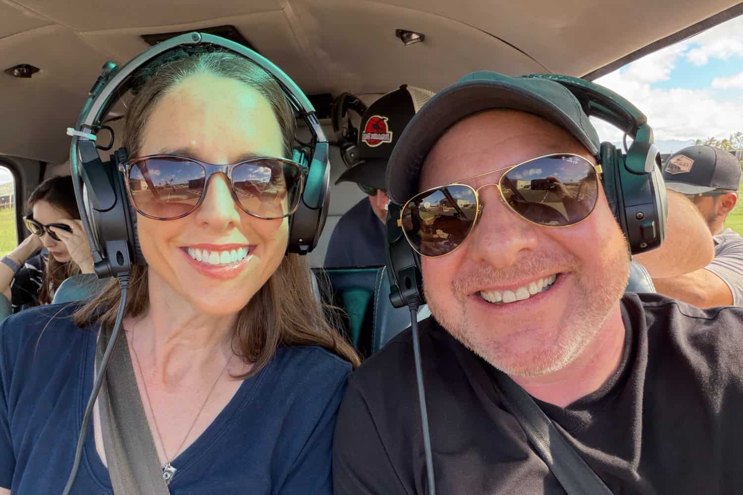 Dave and Kel are strapped in to a helicopter and ready for takeoff at Lihue Airport on Kauai.