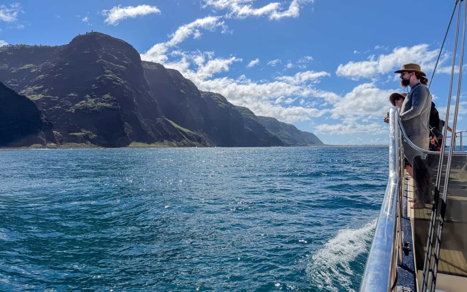 Passengers of a Capt Andy's catamaran cruise take in the scenery.