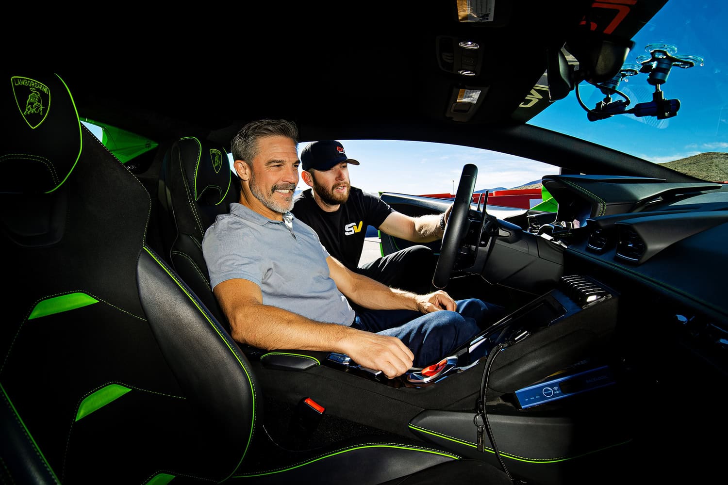 A SPEED VEGAS staff member gives instruction on driving a Lamborghini.