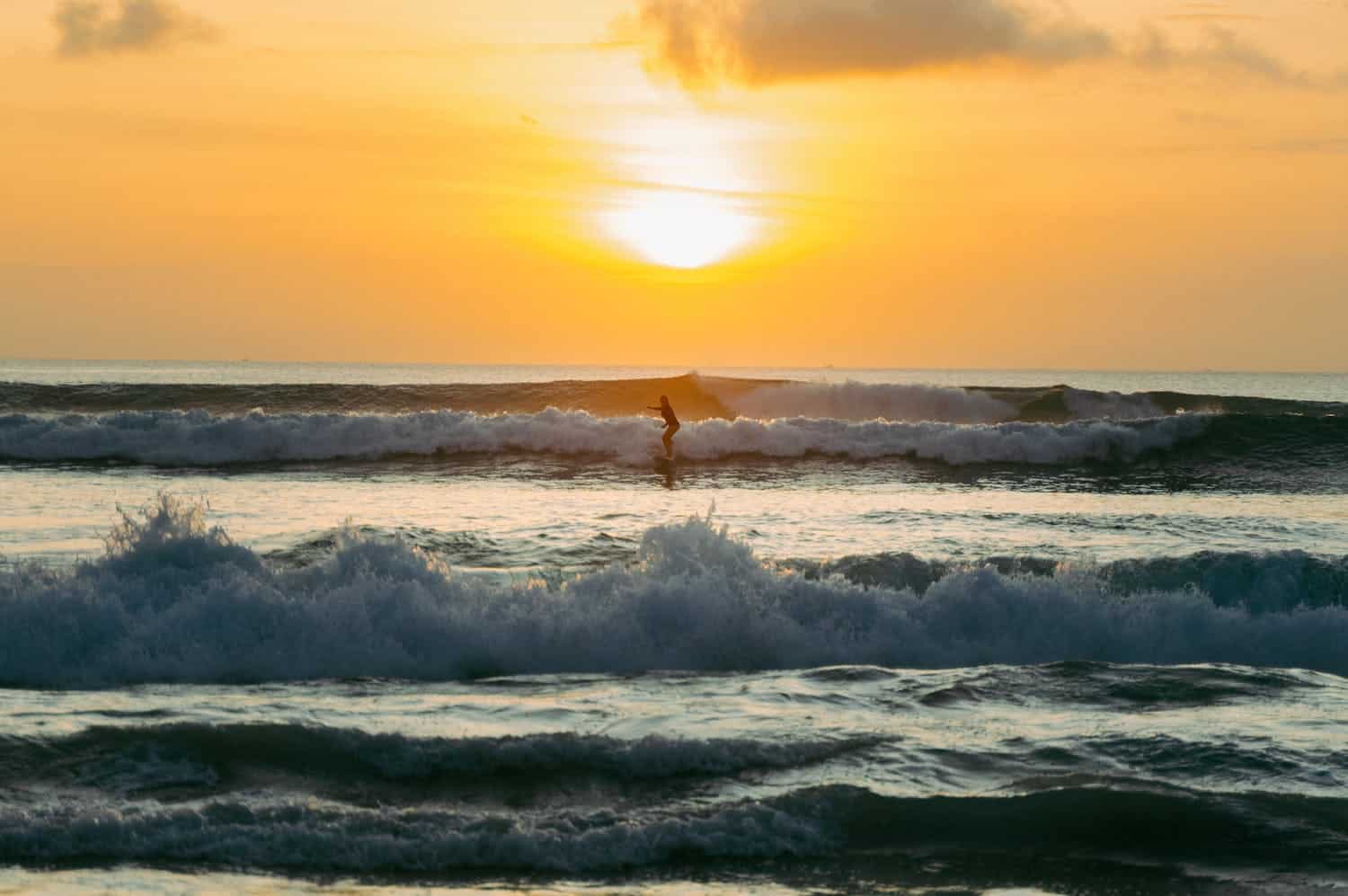 Sunset surf session in Bali (photo: Ilham Zovanka, Pexels).