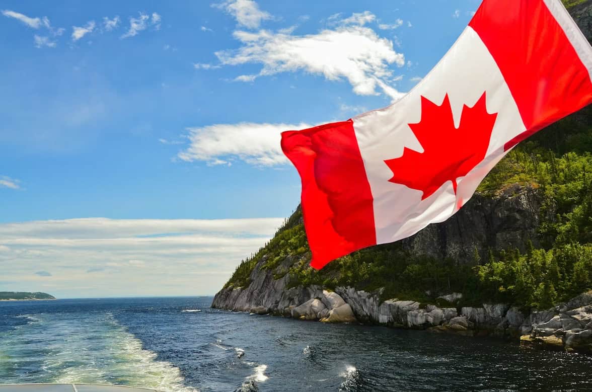 Canadian flag on the back of a boat.