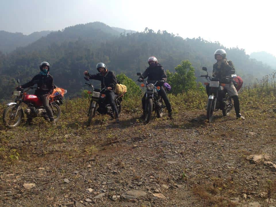 Travelers on motorbikes somewhere in the mountains of Vietnam