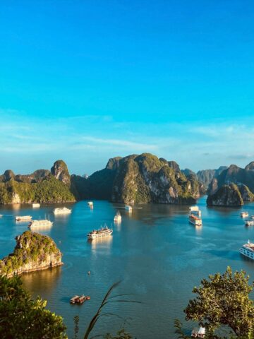 Cruise boats among limestone karsts in Ha Long Bay, Vietnam