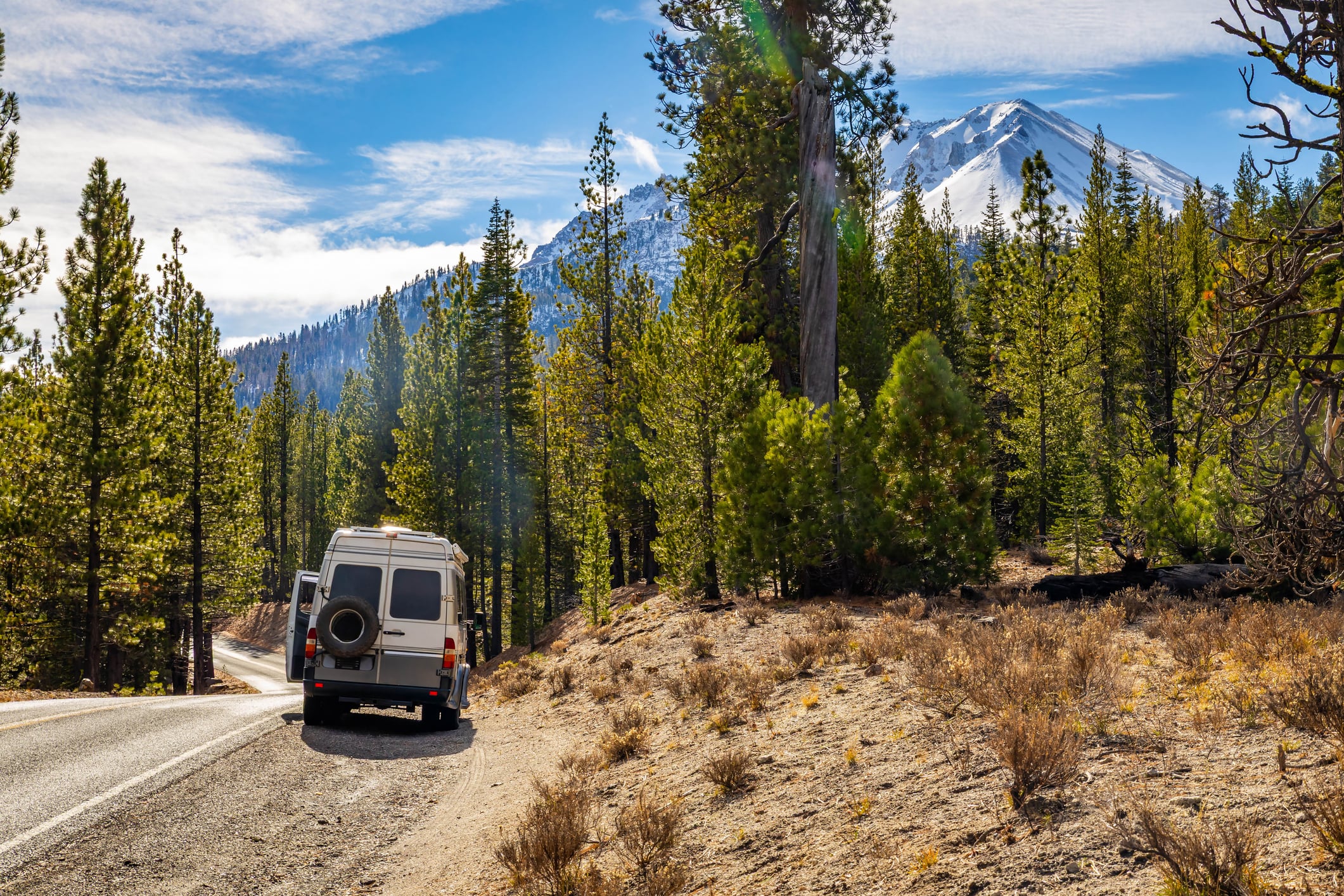 Campervan parked beside a mountain road in Lassen Volcanic National Park