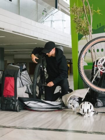 Cyclist disassembling a bicycle for air travel at Lanzarote Airport