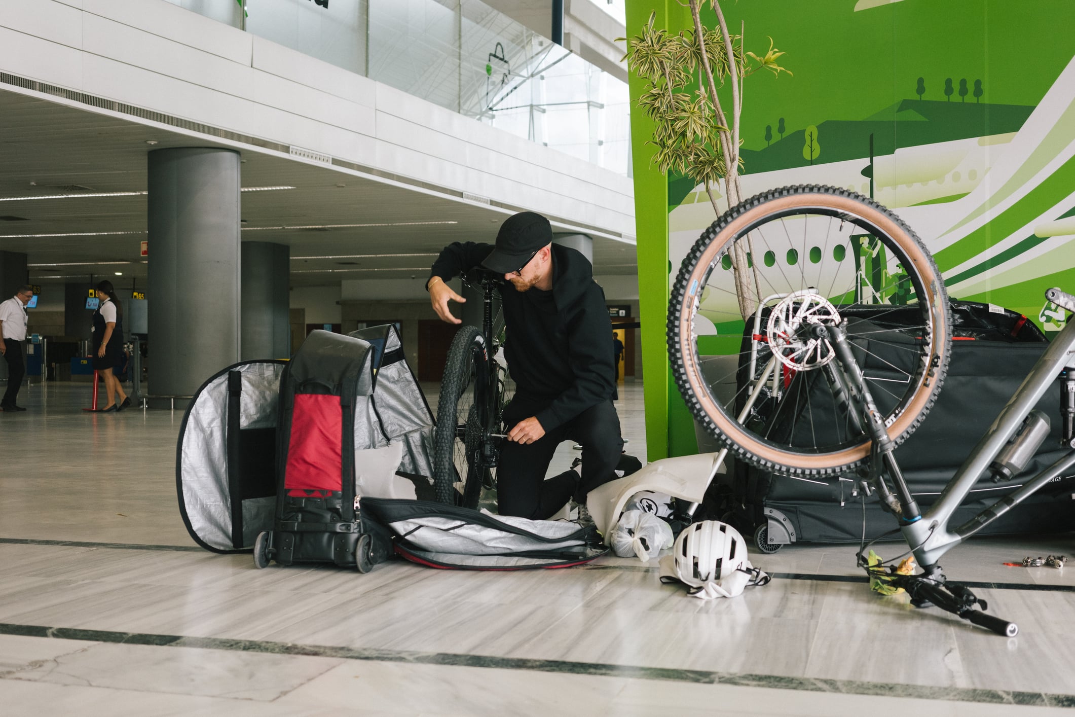 Cyclist disassembling a bicycle for air travel at Lanzarote Airport