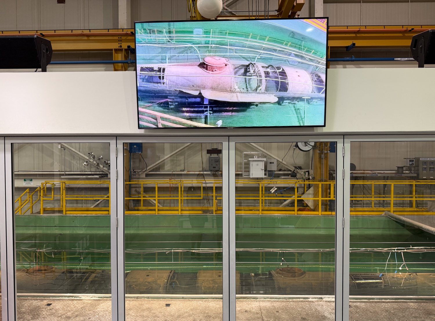 Monitor showing the H. L. Hunley above the submarine's conservation tank in North Charleston.