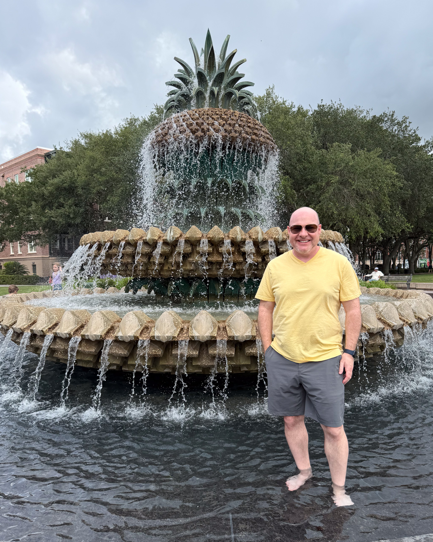 Dave standing barefoot in Pineapple Fountain at Waterfront Park in Charleston.
