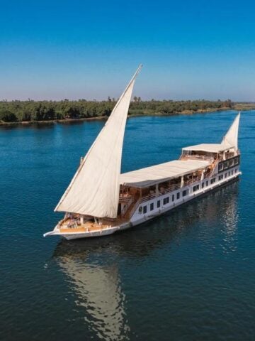 Aerial view of Swan Dahabiya sailing on the Nile River
