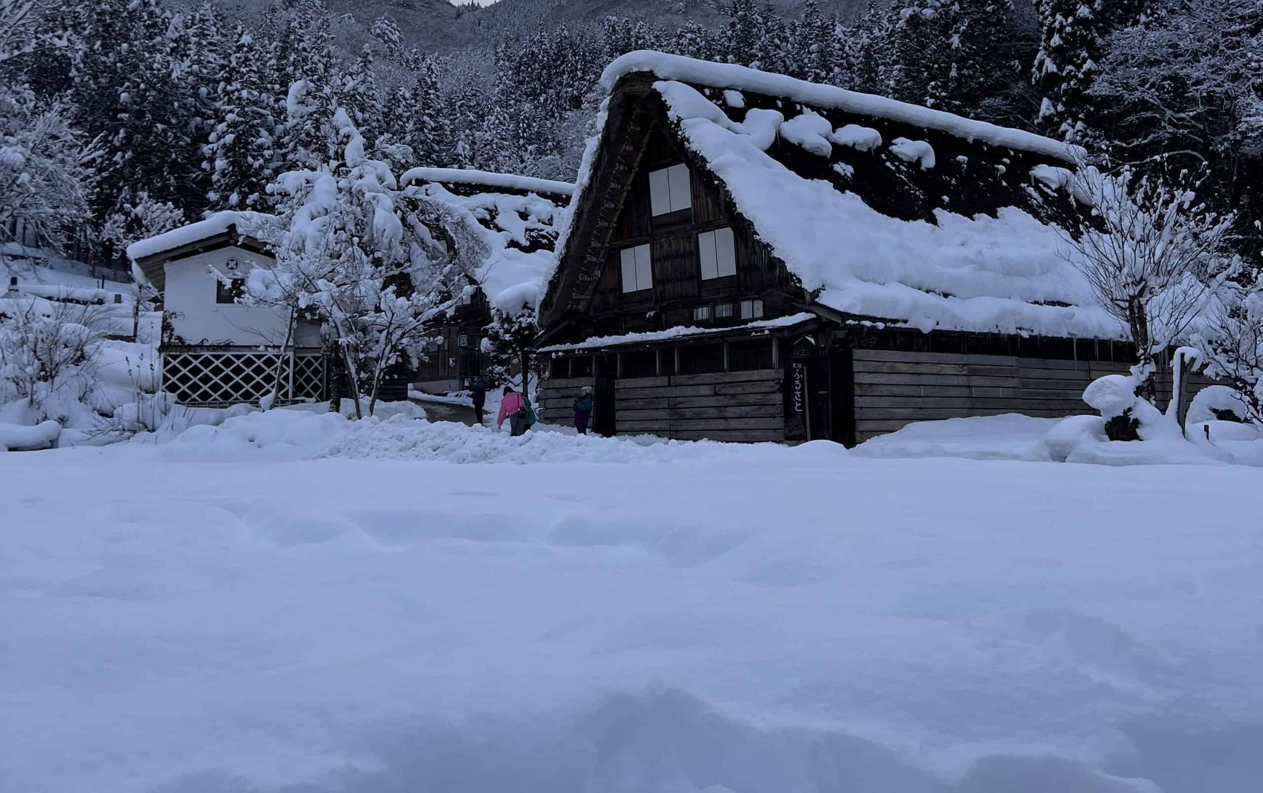 Traditional gassho-zukuri farmhouse covered in snow in Shirakawa-go