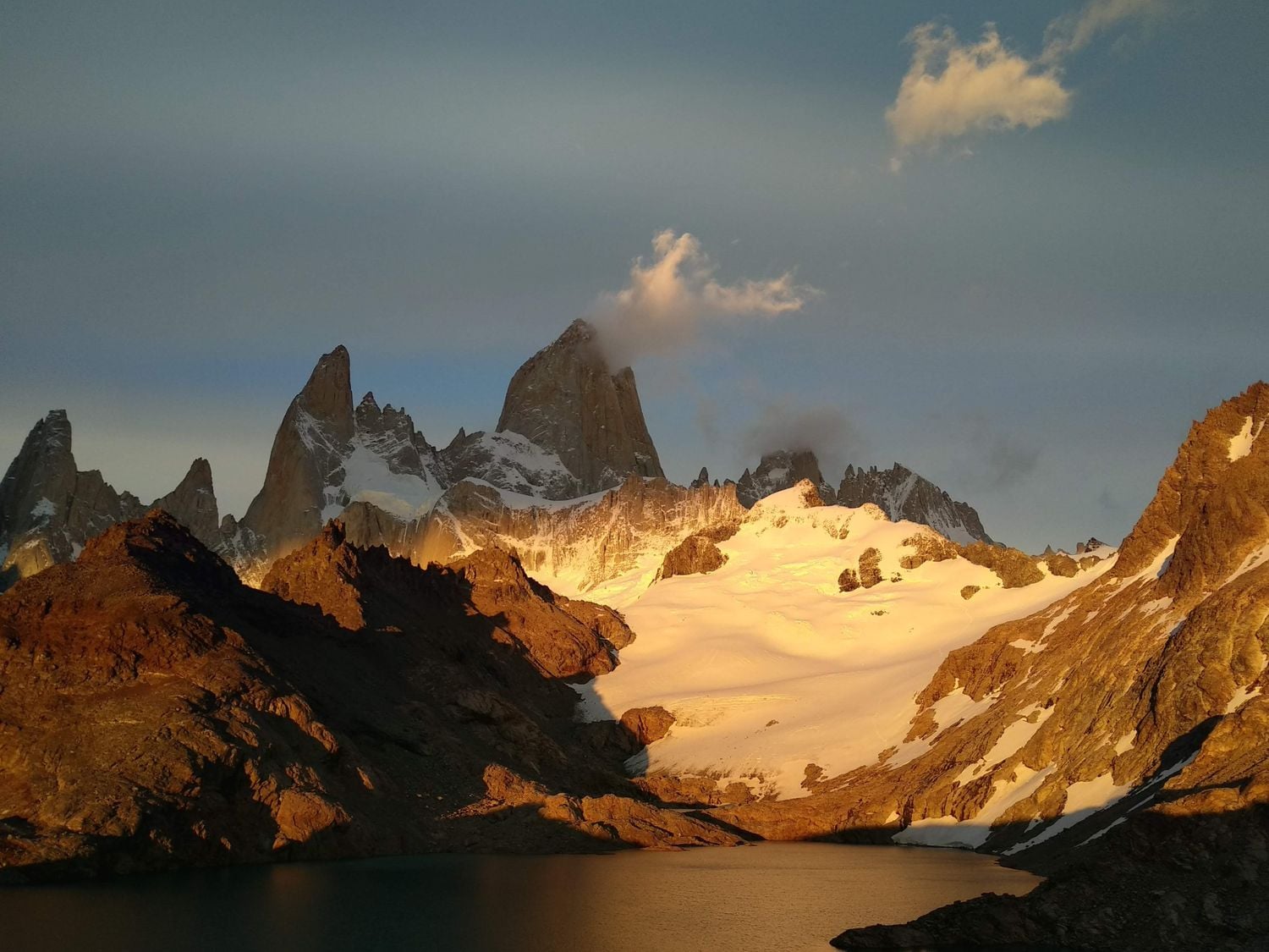 Sunrise over Andes Mountains and lake in Argentina.