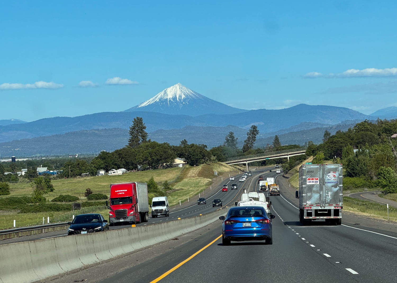 Highway traffic and a distant snow-covered mountain during my Portland to Medford road trip.