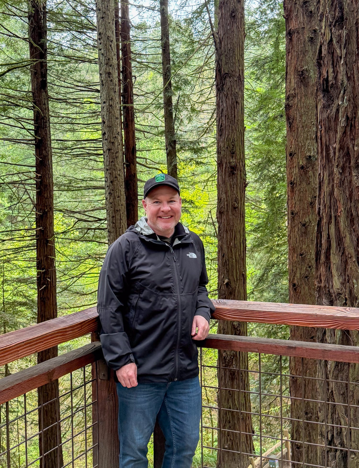 Dave standing on the Redwood Deck among tall trees at Hoyt Arboretum in Portland.