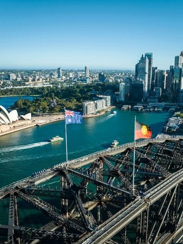 Aerial view of Sydney Harbour with Opera House and Harbour Bridge.